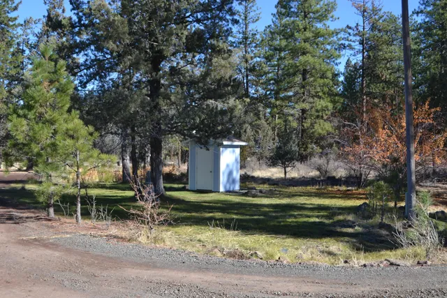 a view of a lake with lots of trees