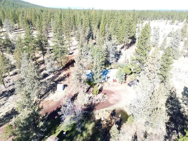 a view of swimming pool with a yard