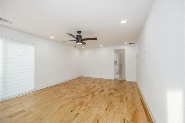 a view of an empty room with a window