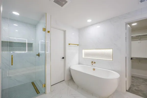 a bathroom with granite countertop a sink and a mirror