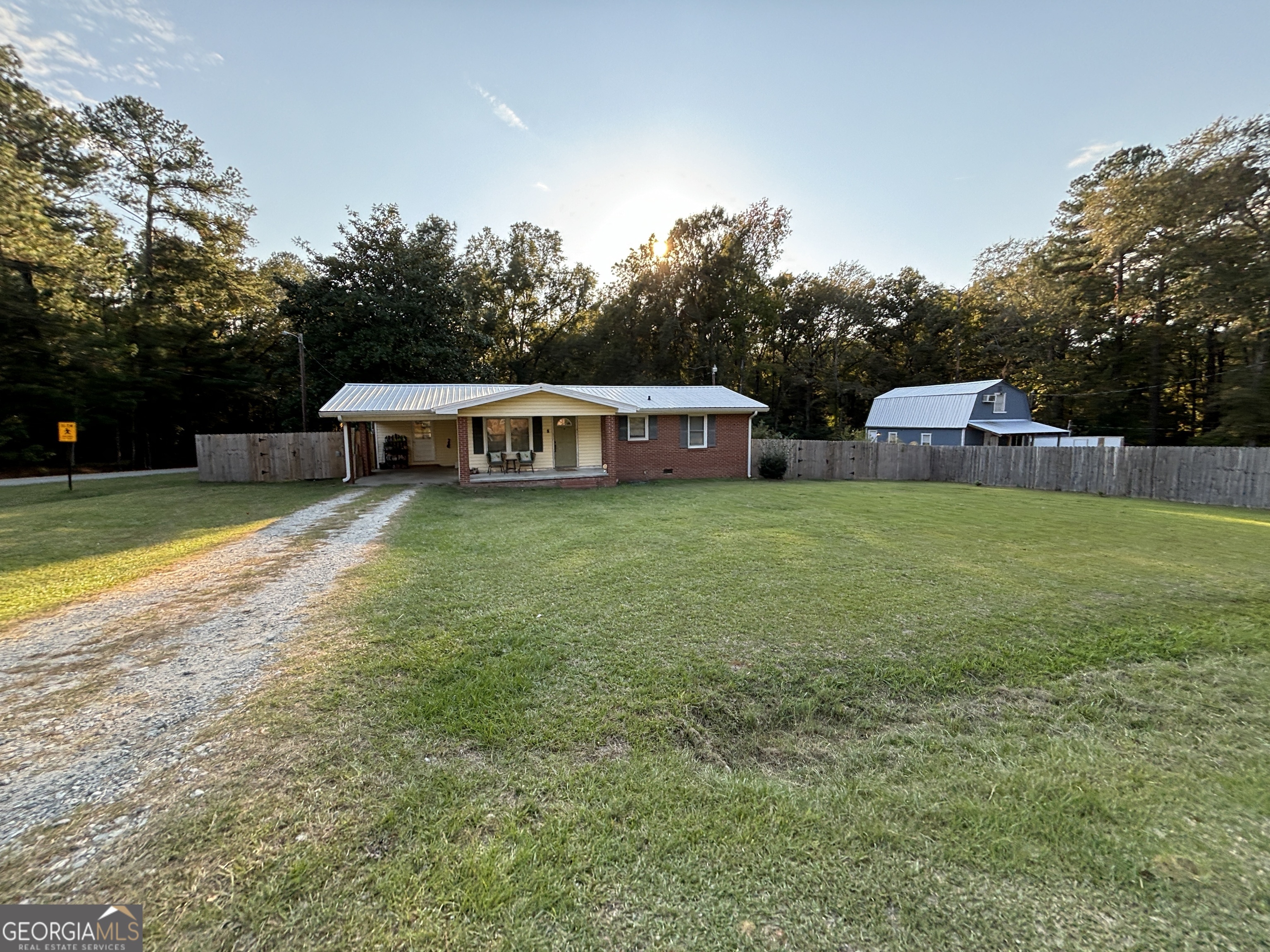 114 Creekwood Road Cochran, GA 31014 - Photo 1 of 1 a view of a house with swimming pool and yard
