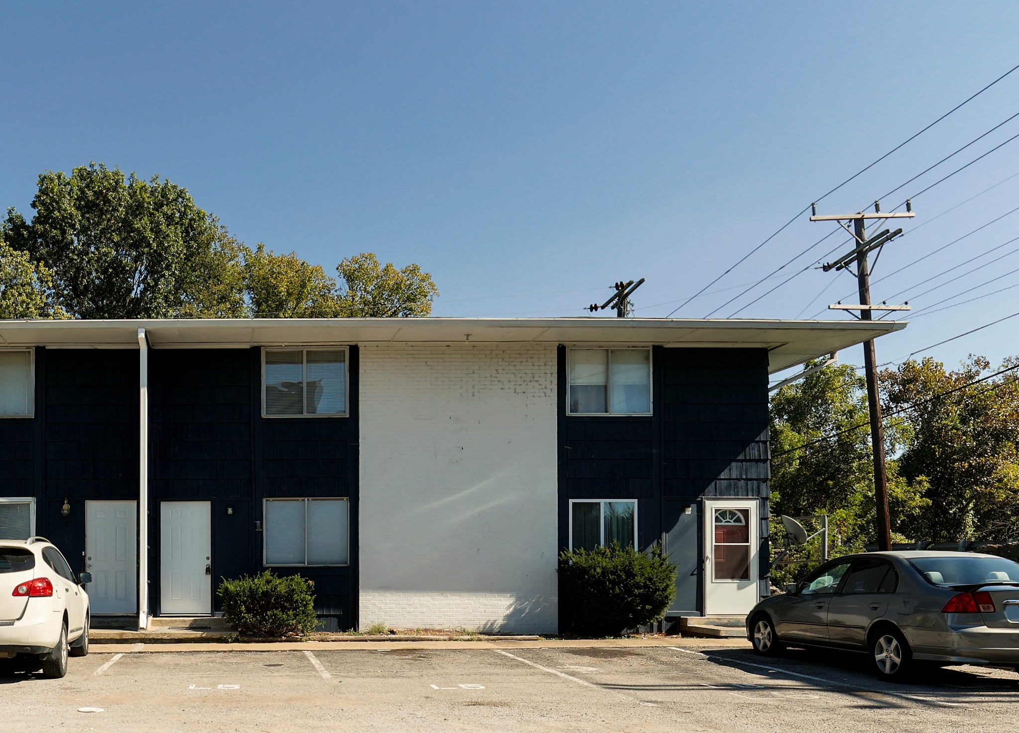 a view of a car parked in front of a house