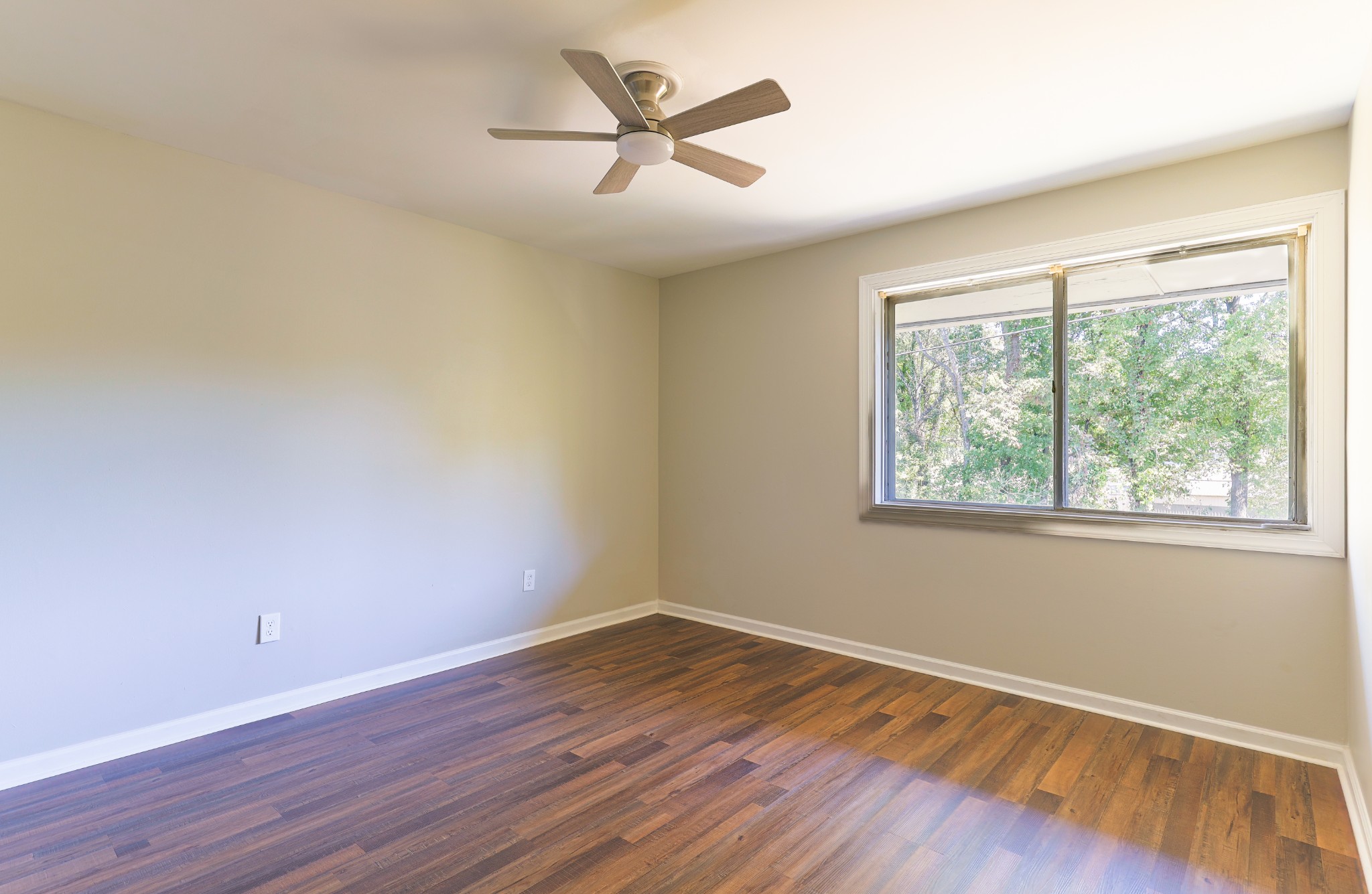 320 Welch Road, Unit L5 Nashville, TN 37211 - Photo 11 of 12 an empty room with wooden floor and windows