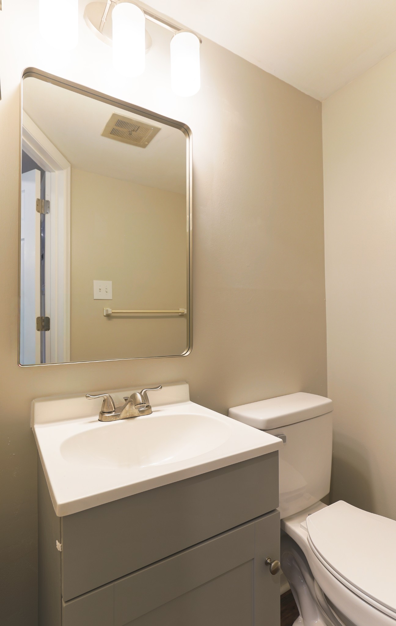 320 Welch Road, Unit L5 Nashville, TN 37211 - Photo 6 of 12 a bathroom with a sink a toilet and mirror