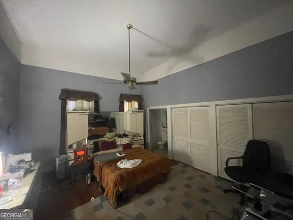 a view of a livingroom with furniture and a workspace