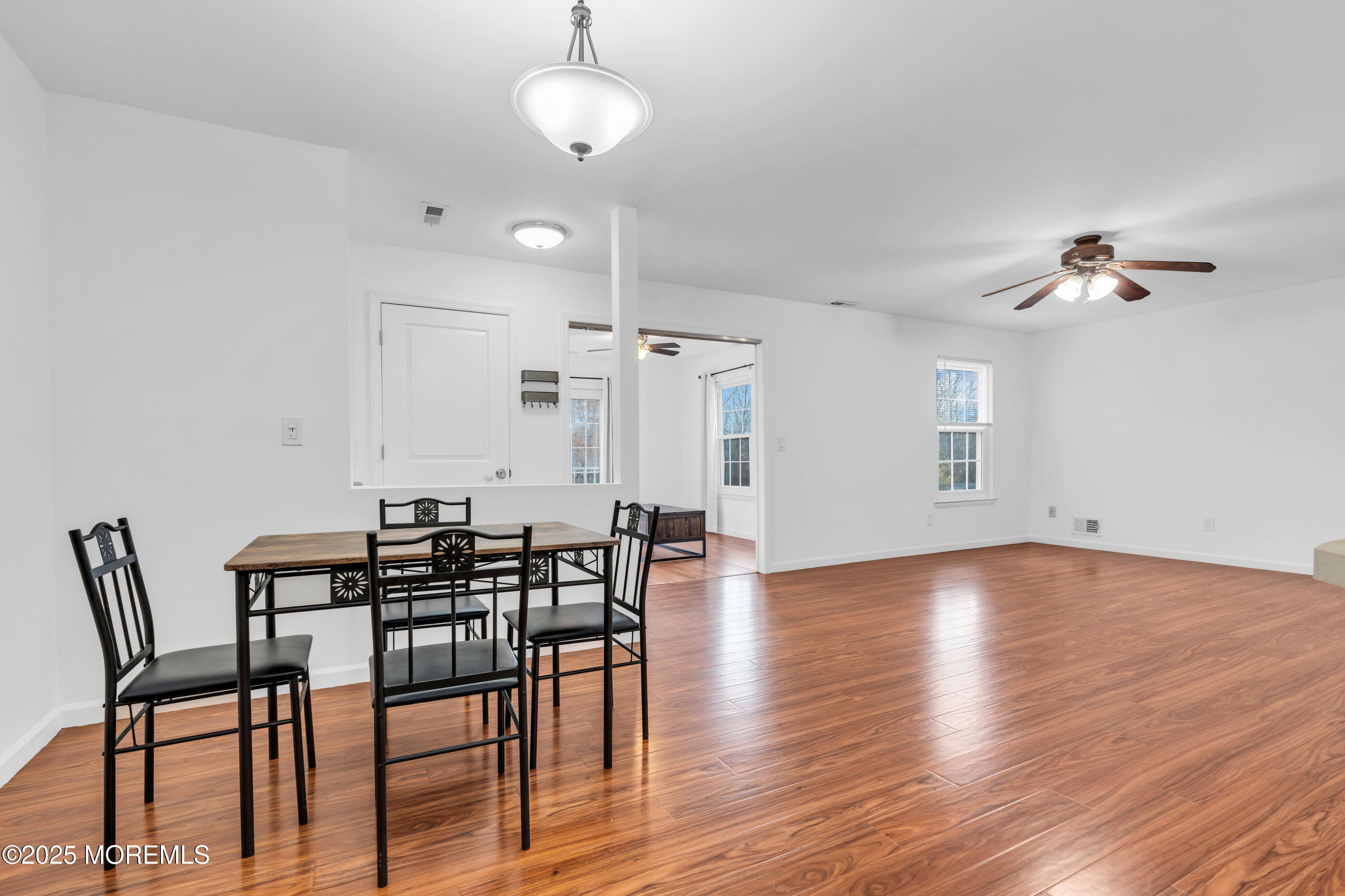 507 Harding Road, Unit 5 Freehold, NJ 07728 - Photo 29 of 35 a view of a dining room with furniture and wooden floor