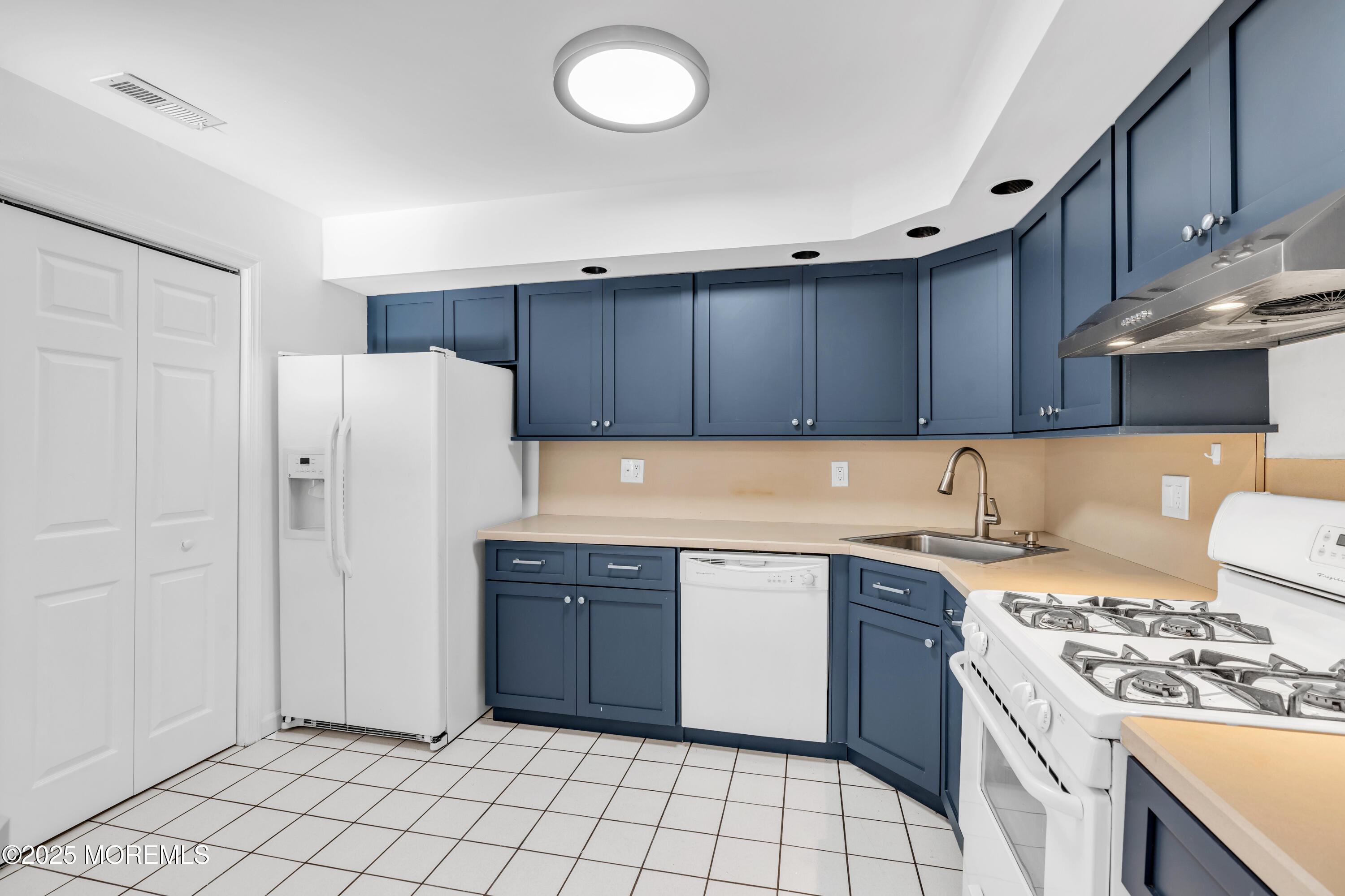 507 Harding Road, Unit 5 Freehold, NJ 07728 - Photo 6 of 35 a kitchen with a sink a stove and refrigerator