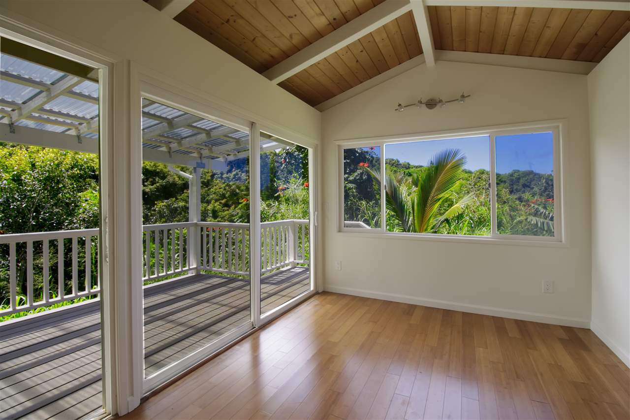 77 Nahele Road Haiku, HI 96708 - Photo 30 of 30 a view of a room with wooden floor and windows
