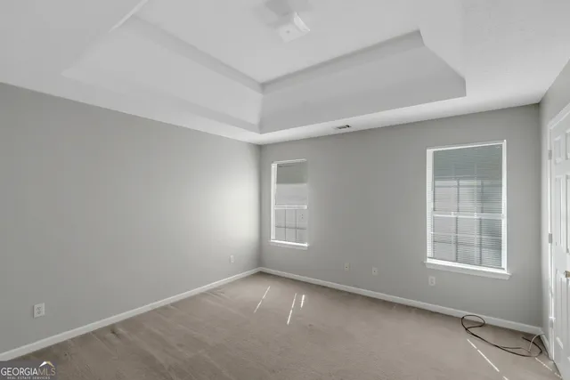 an empty room with windows