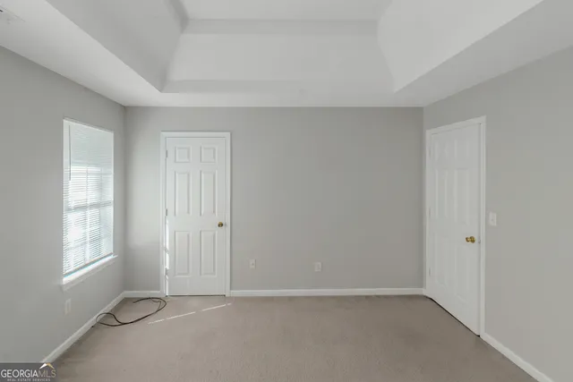 a view of an empty room with windows
