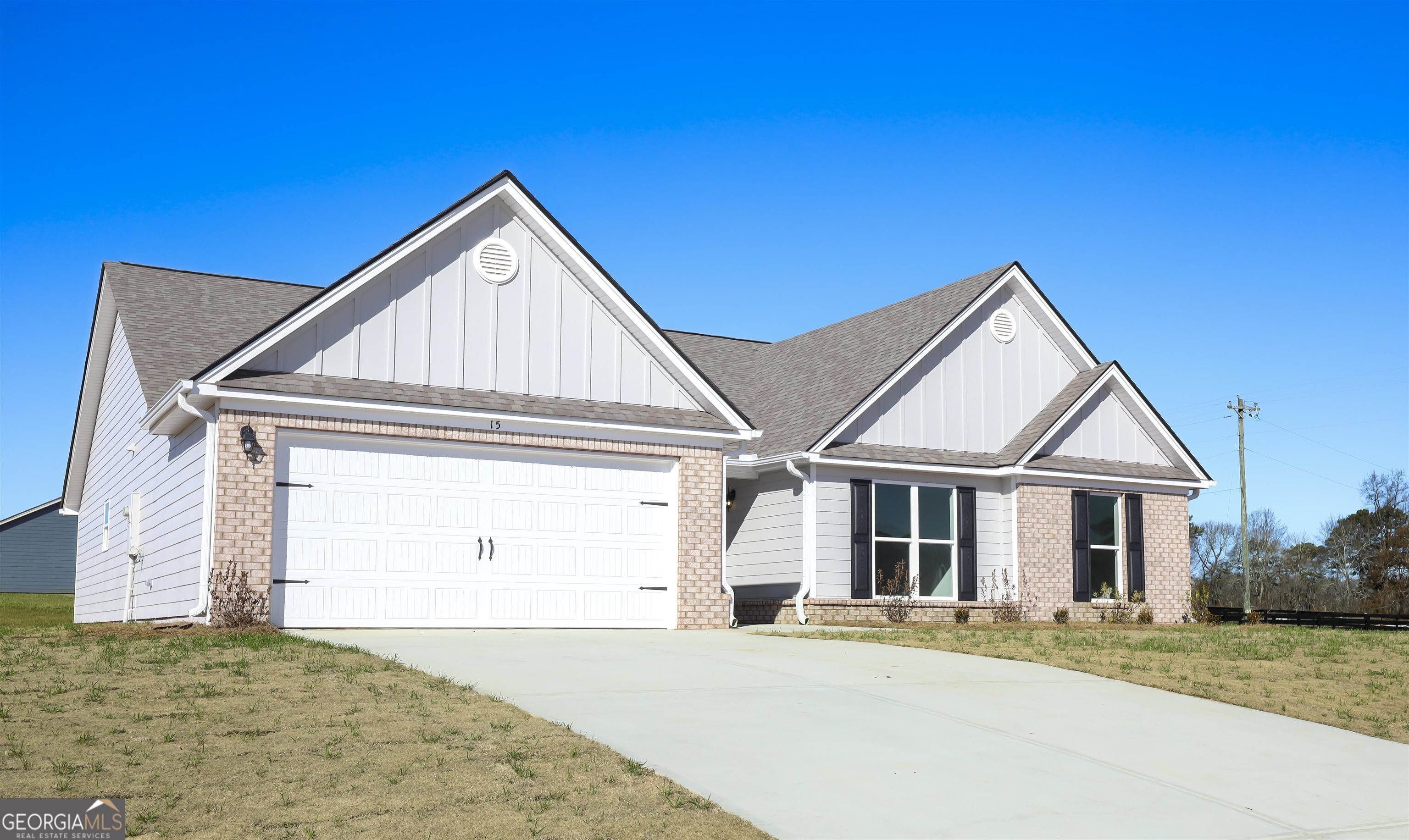 457 Tanners Bridge Circle, Unit 4 Bethlehem, GA 30620 - Photo 1 of 24 a front view of a house with a yard
