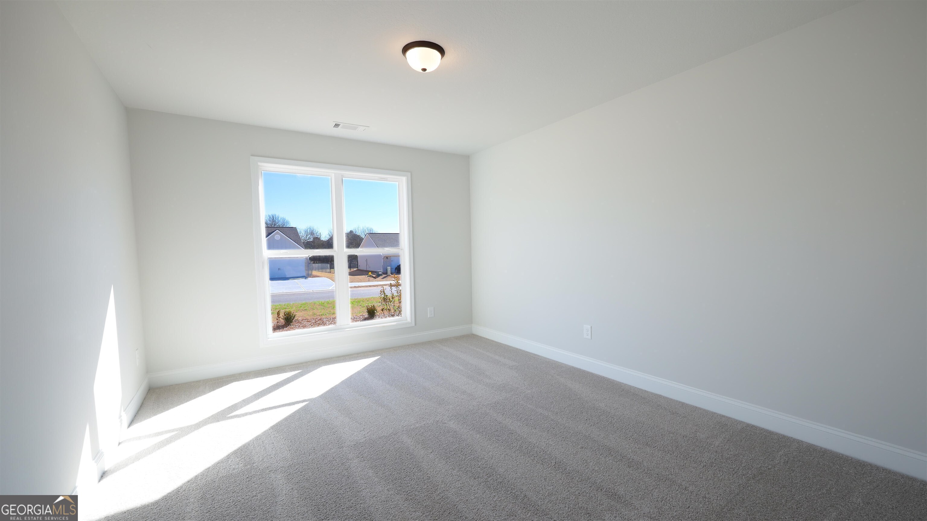 457 Tanners Bridge Circle, Unit 4 Bethlehem, GA 30620 - Photo 11 of 24 an empty room with a window