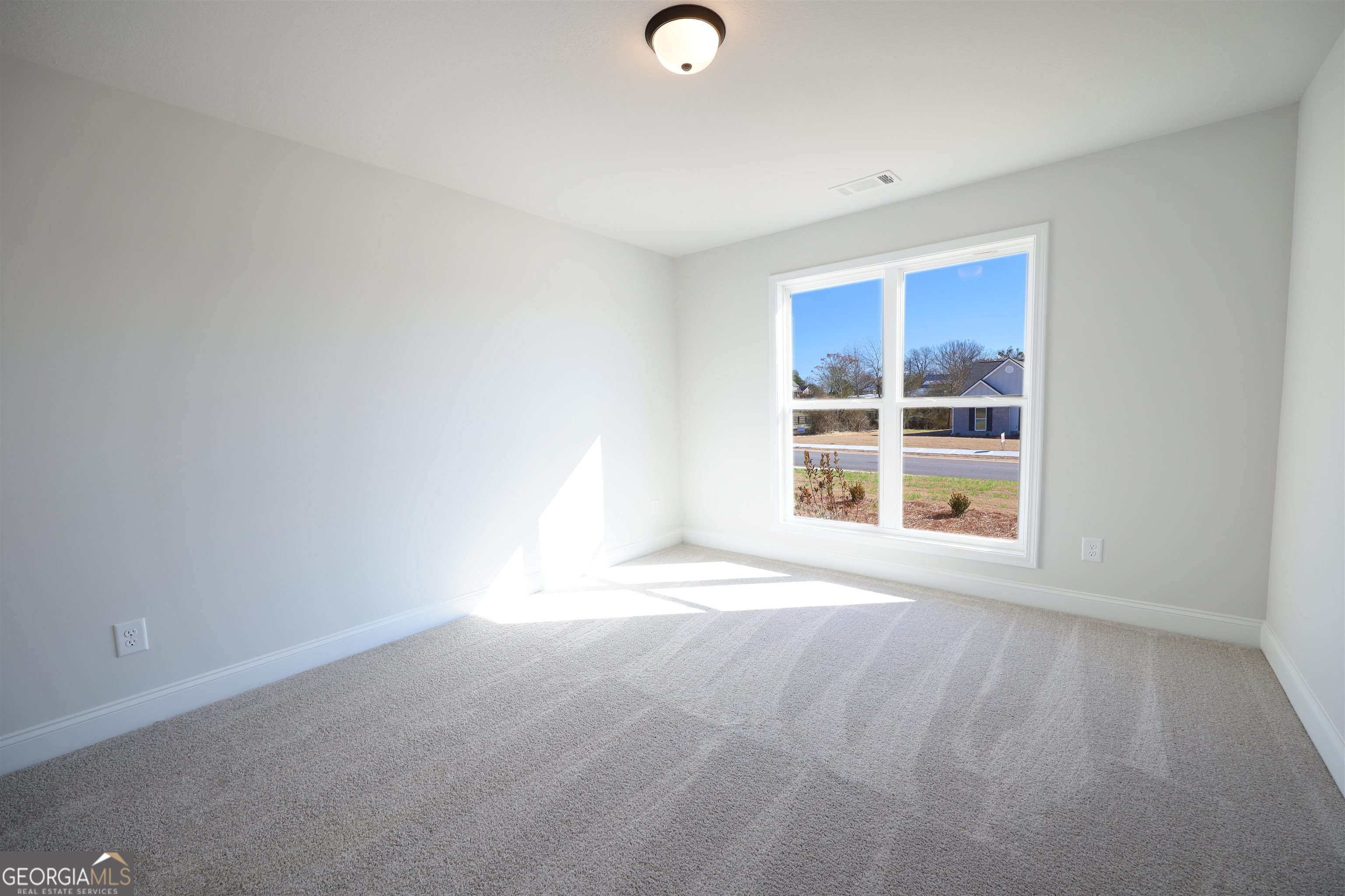 457 Tanners Bridge Circle, Unit 4 Bethlehem, GA 30620 - Photo 12 of 24 a view of an empty room with a window