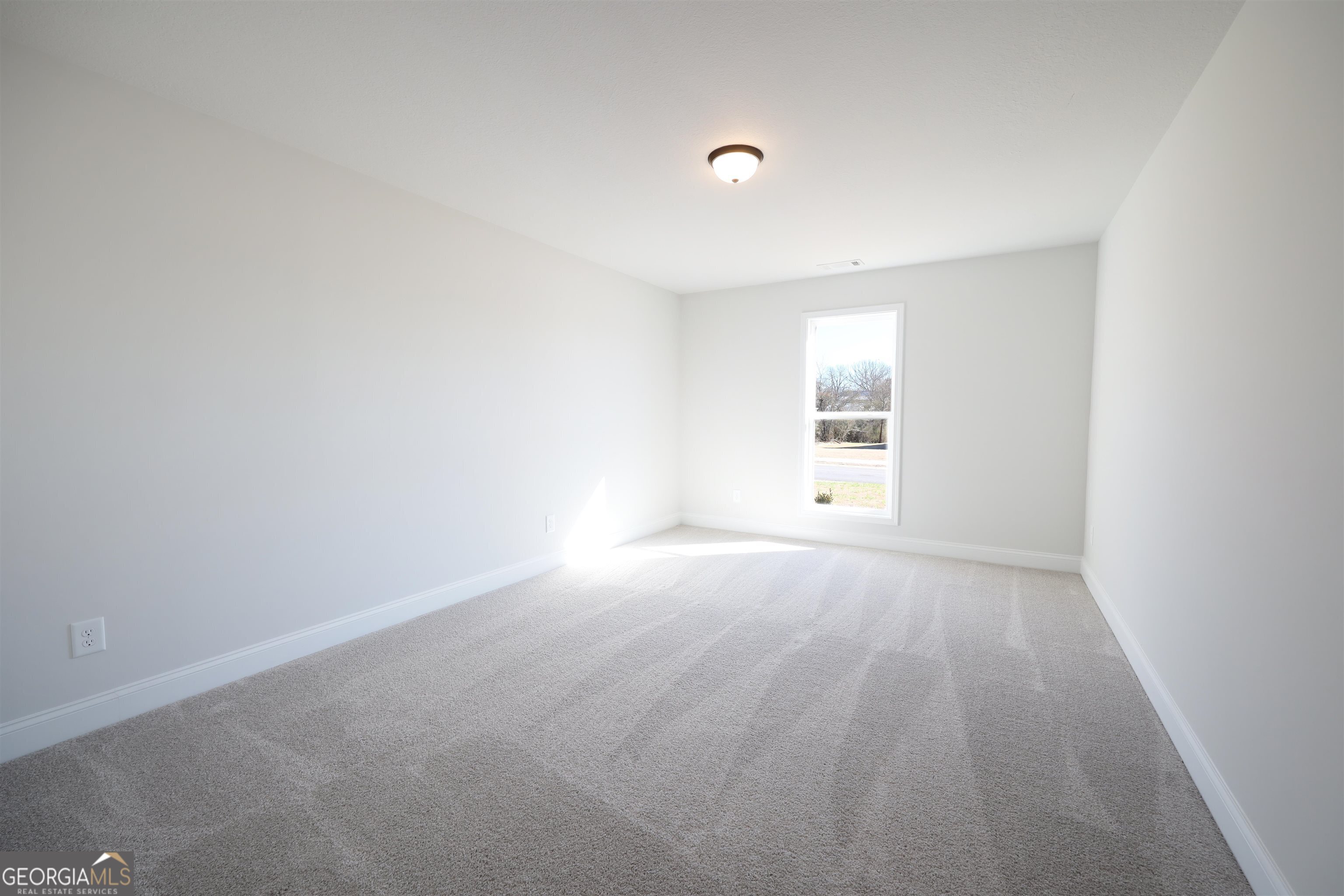 457 Tanners Bridge Circle, Unit 4 Bethlehem, GA 30620 - Photo 13 of 24 a view of empty room with window