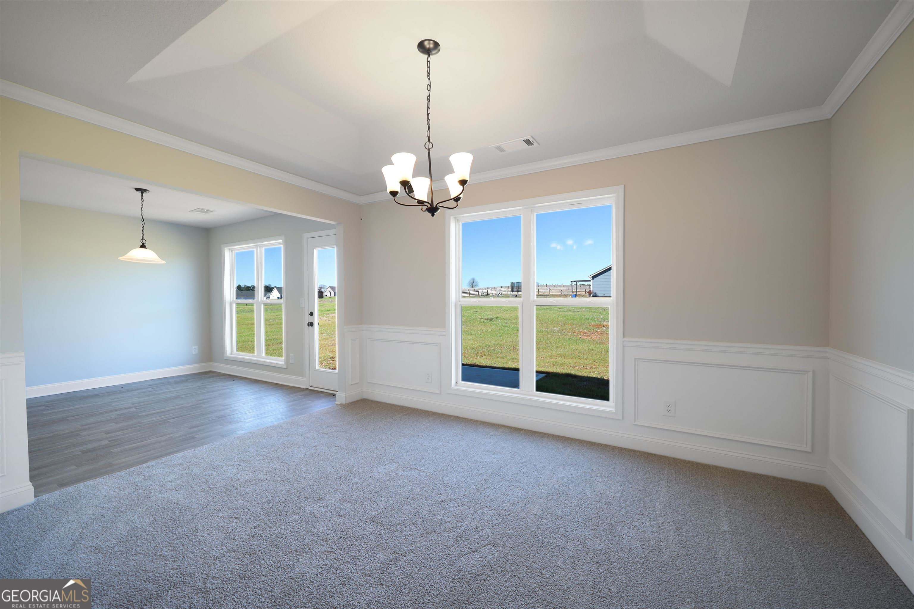 457 Tanners Bridge Circle, Unit 4 Bethlehem, GA 30620 - Photo 15 of 24 a view of an empty room with a window and a kitchen