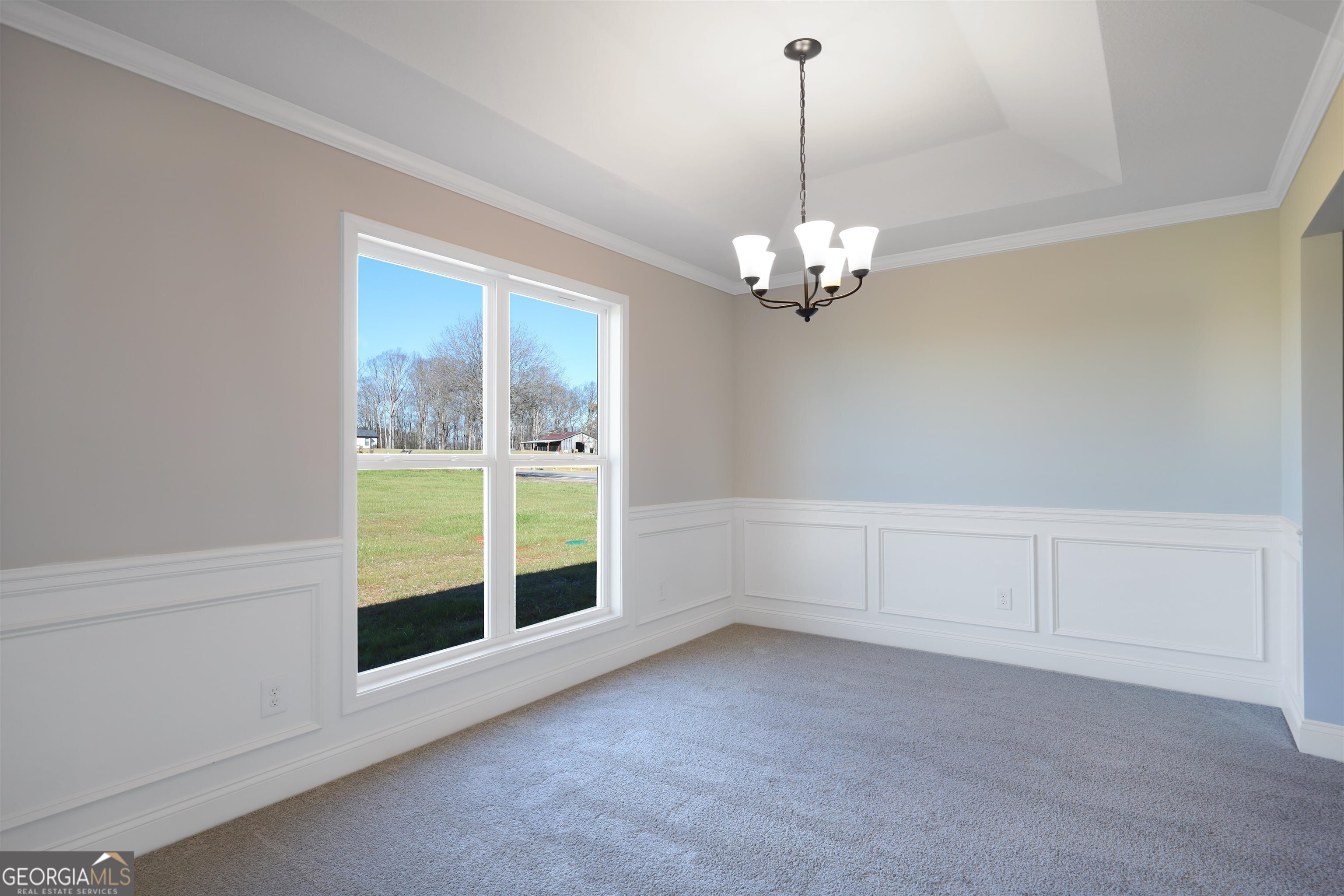 457 Tanners Bridge Circle, Unit 4 Bethlehem, GA 30620 - Photo 16 of 24 a view of a livingroom with a chandelier fan and windows