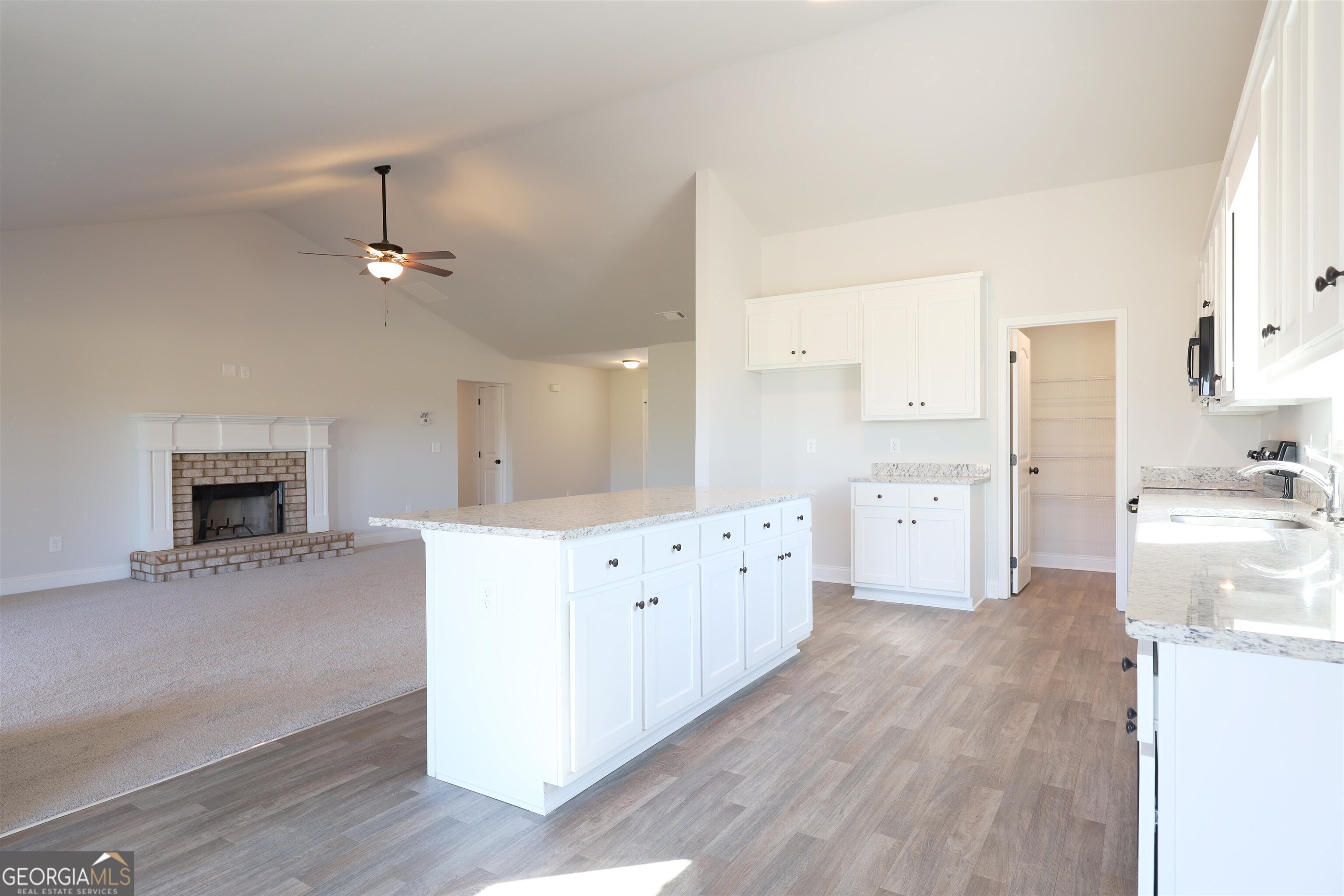 457 Tanners Bridge Circle, Unit 4 Bethlehem, GA 30620 - Photo 7 of 24 a large white kitchen with cabinets