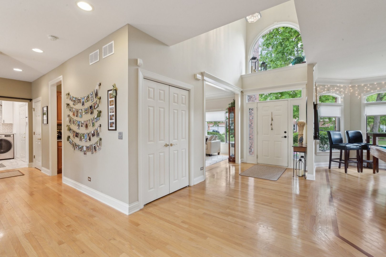 2156 Red Maple Lane Aurora, IL 60502 - Photo 3 of 57 a view of a hallway with wooden floor and entryway