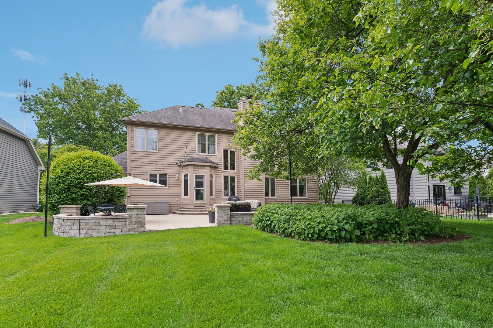 2156 Red Maple Lane Aurora, IL 60502 - Photo 57 of 57 a front view of a house with a garden and plants