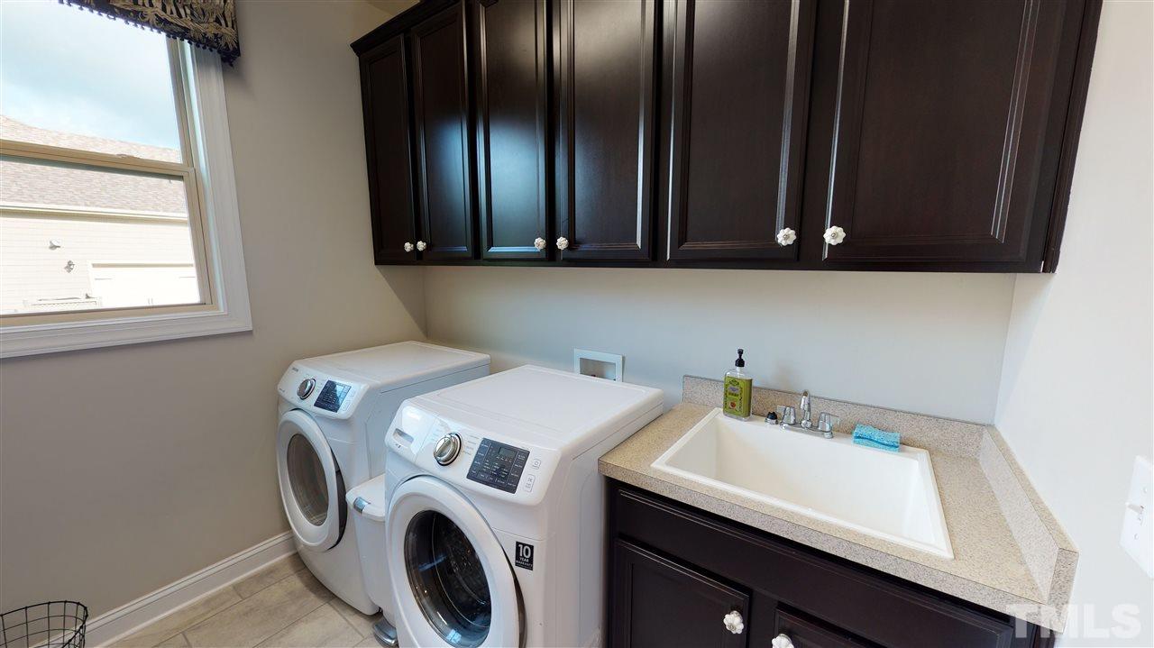 3116 Umstead View Drive Raleigh, NC 27607 - Photo 14 of 30 Beautiful laundry room downstairs with a window and sink!