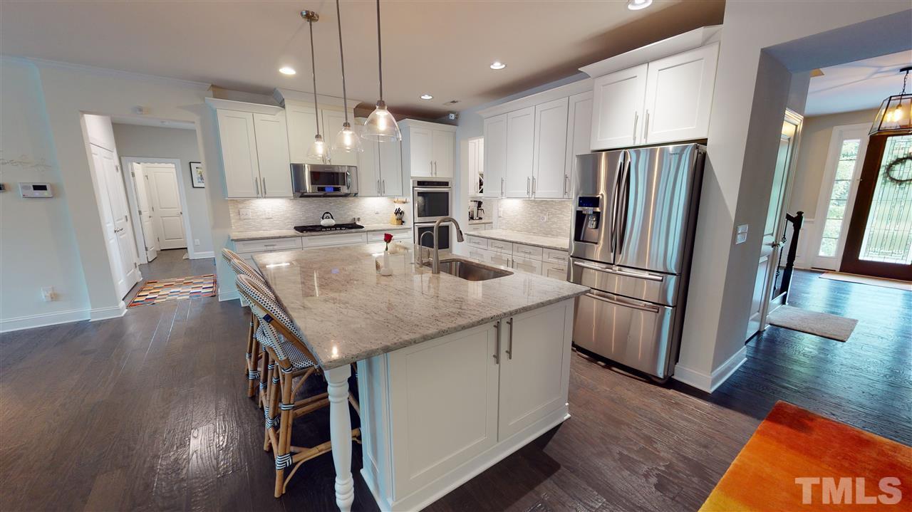 3116 Umstead View Drive Raleigh, NC 27607 - Photo 5 of 30 Kitchen makes entertaining a breeze with easy access to the dining room, living room and backyard living spaces!