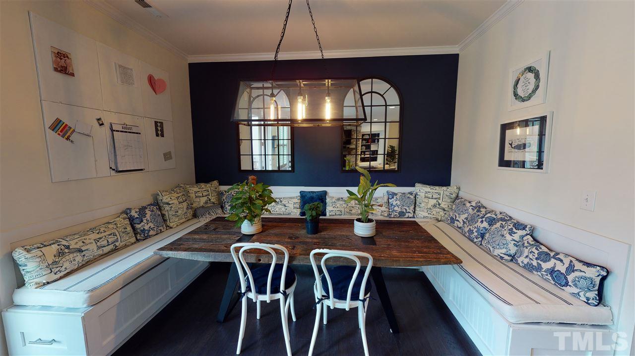 3116 Umstead View Drive Raleigh, NC 27607 - Photo 7 of 30 Kitchen eating nook features custom built in seating modeled after the kitchen cabinets!