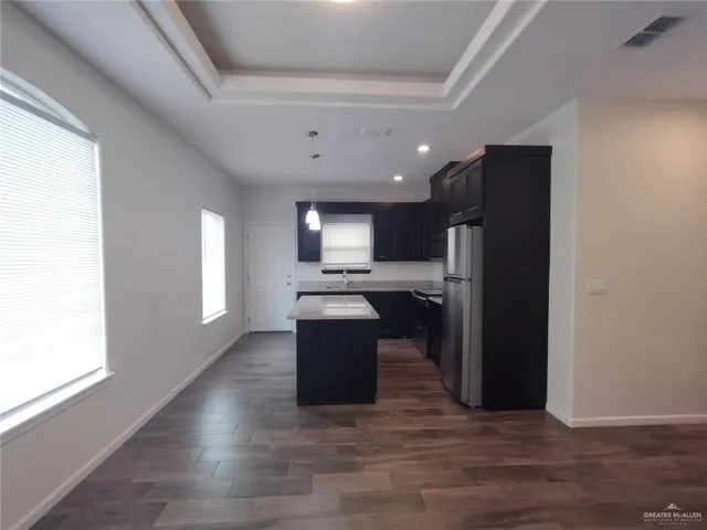 a kitchen with a sink and a stove