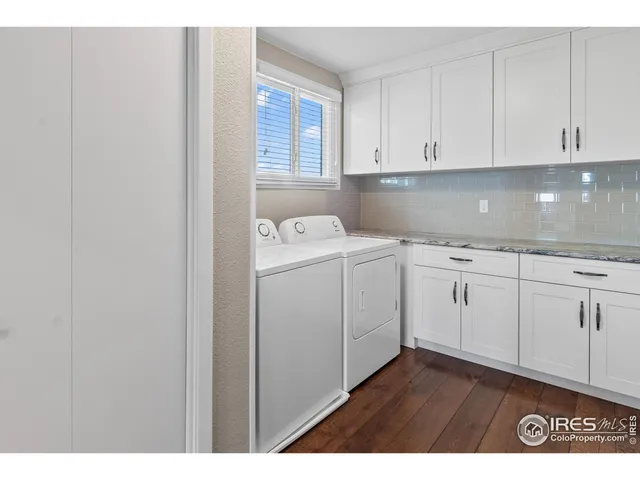 a view of cabinets with wooden floor