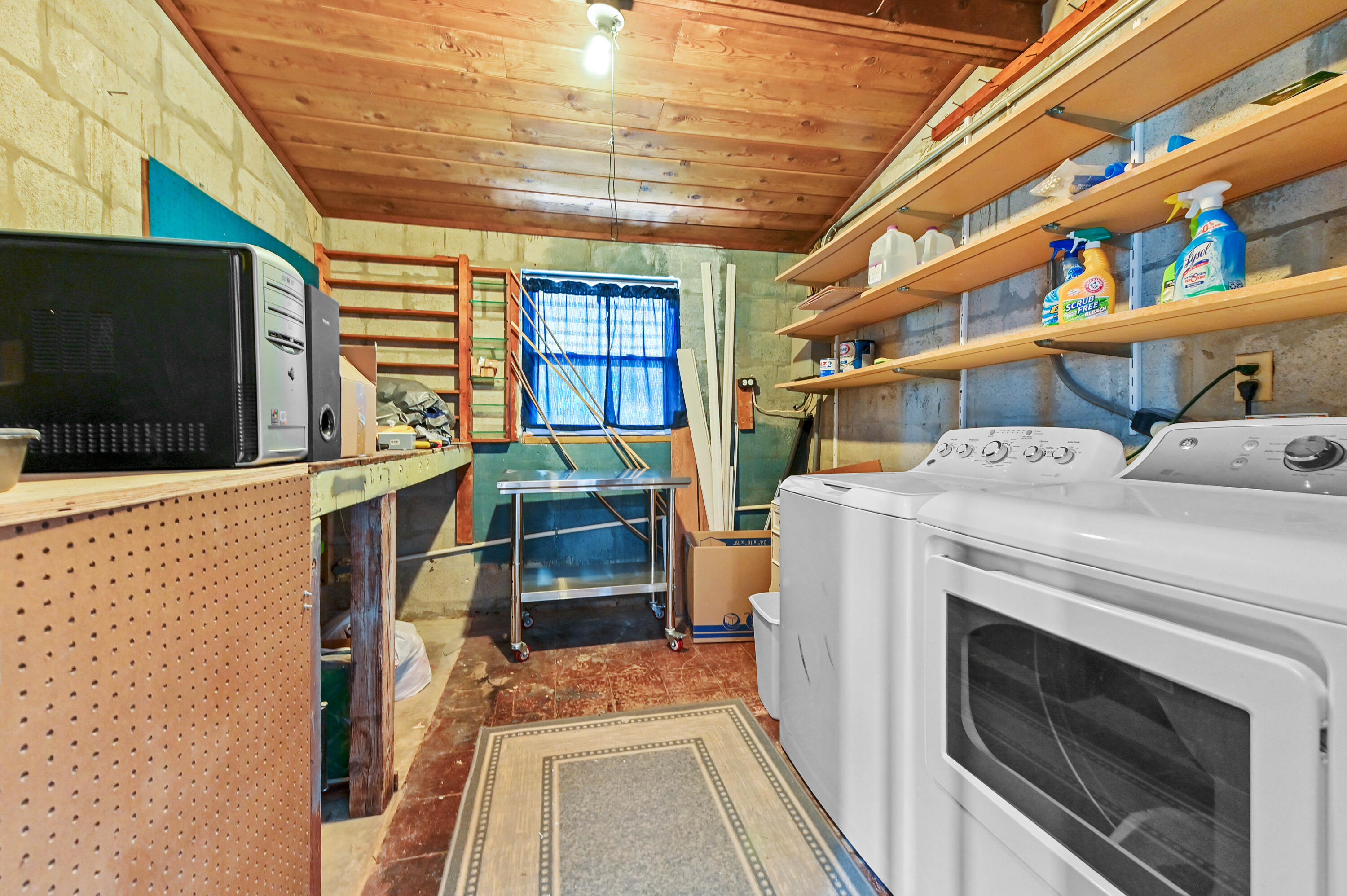 5709 Southeast Indigo Avenue Stuart, FL 34997 - Photo 22 of 26 a utility room with dryer and washer