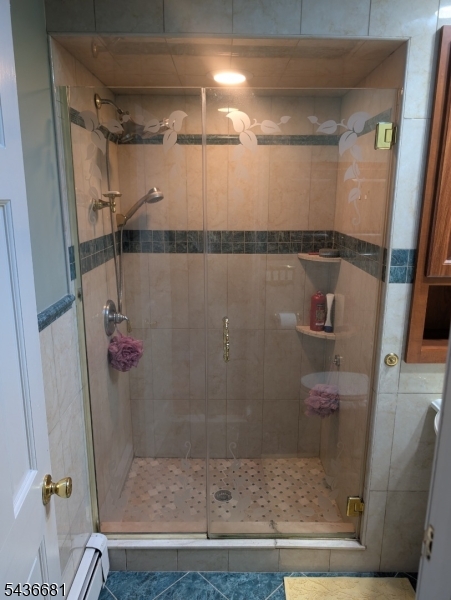 178 East Lindsley Road, Unit 2 Cedar Grove, NJ 07009 - Photo 21 of 28 a bathroom with a glass shower door