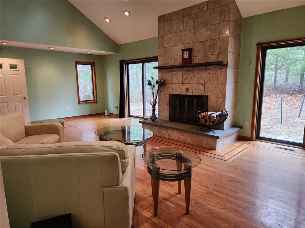 18 Isthmus Road Foster, RI 02825 - Photo 7 of 34 Fireplace, 2 sets of sliders to beautiful views of nature