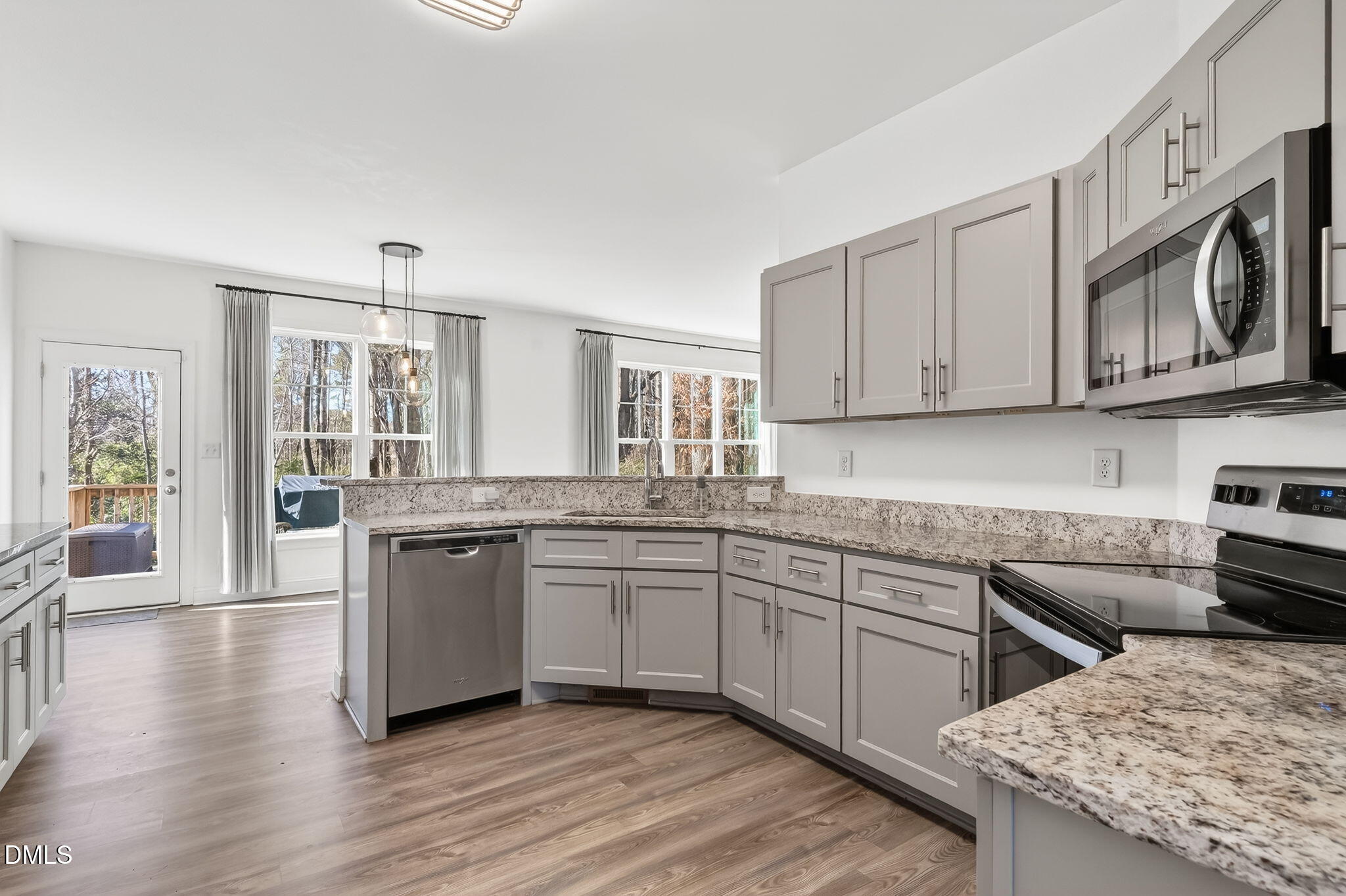 27 Duchess Court Angier, NC 27501 - Photo 8 of 50 a kitchen with stainless steel appliances granite countertop a stove and a sink