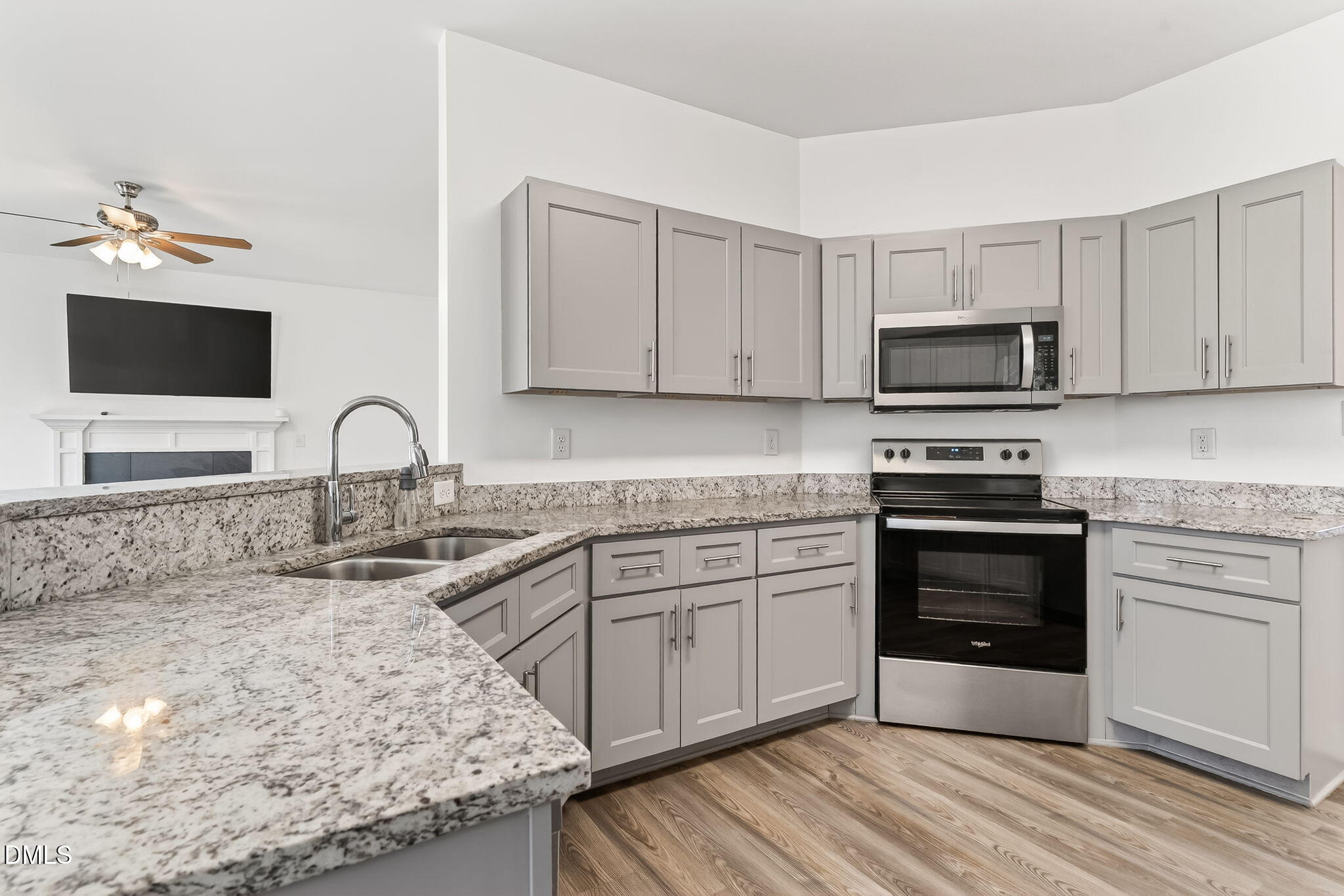 27 Duchess Court Angier, NC 27501 - Photo 10 of 50 a kitchen with sink a microwave and stove