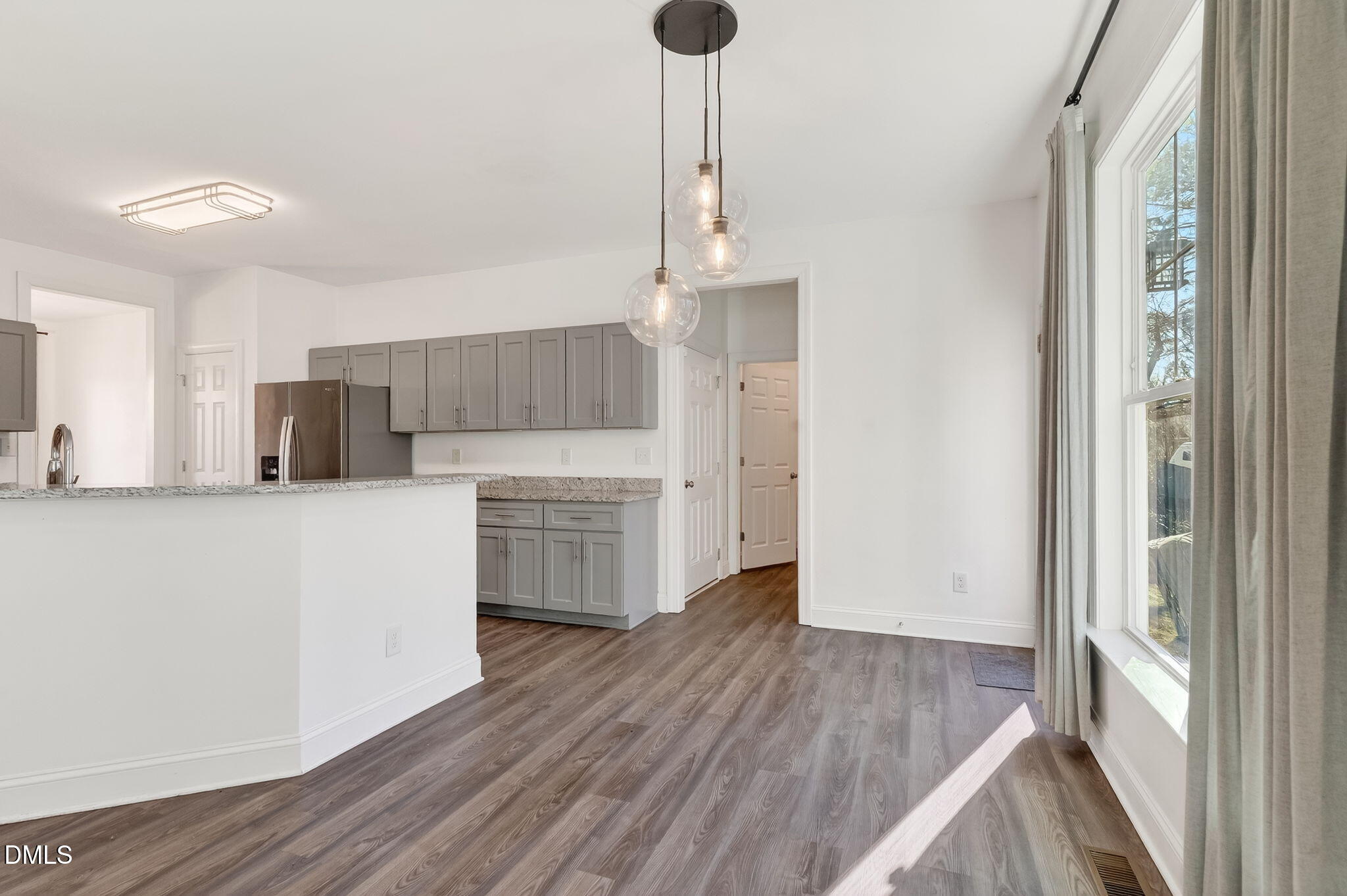 27 Duchess Court Angier, NC 27501 - Photo 13 of 50 a kitchen with stainless steel appliances a refrigerator and a stove top oven