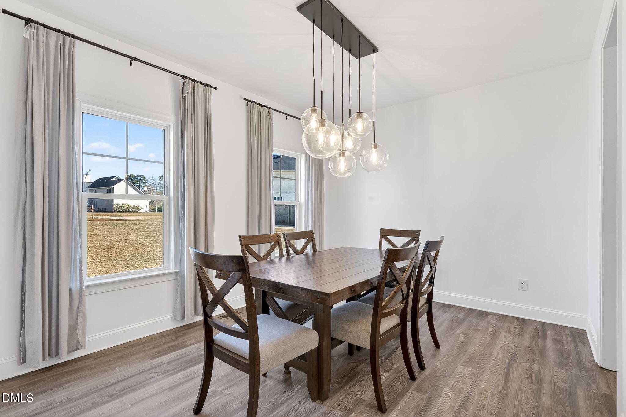 27 Duchess Court Angier, NC 27501 - Photo 14 of 50 a dining room with furniture a chandelier and wooden floor