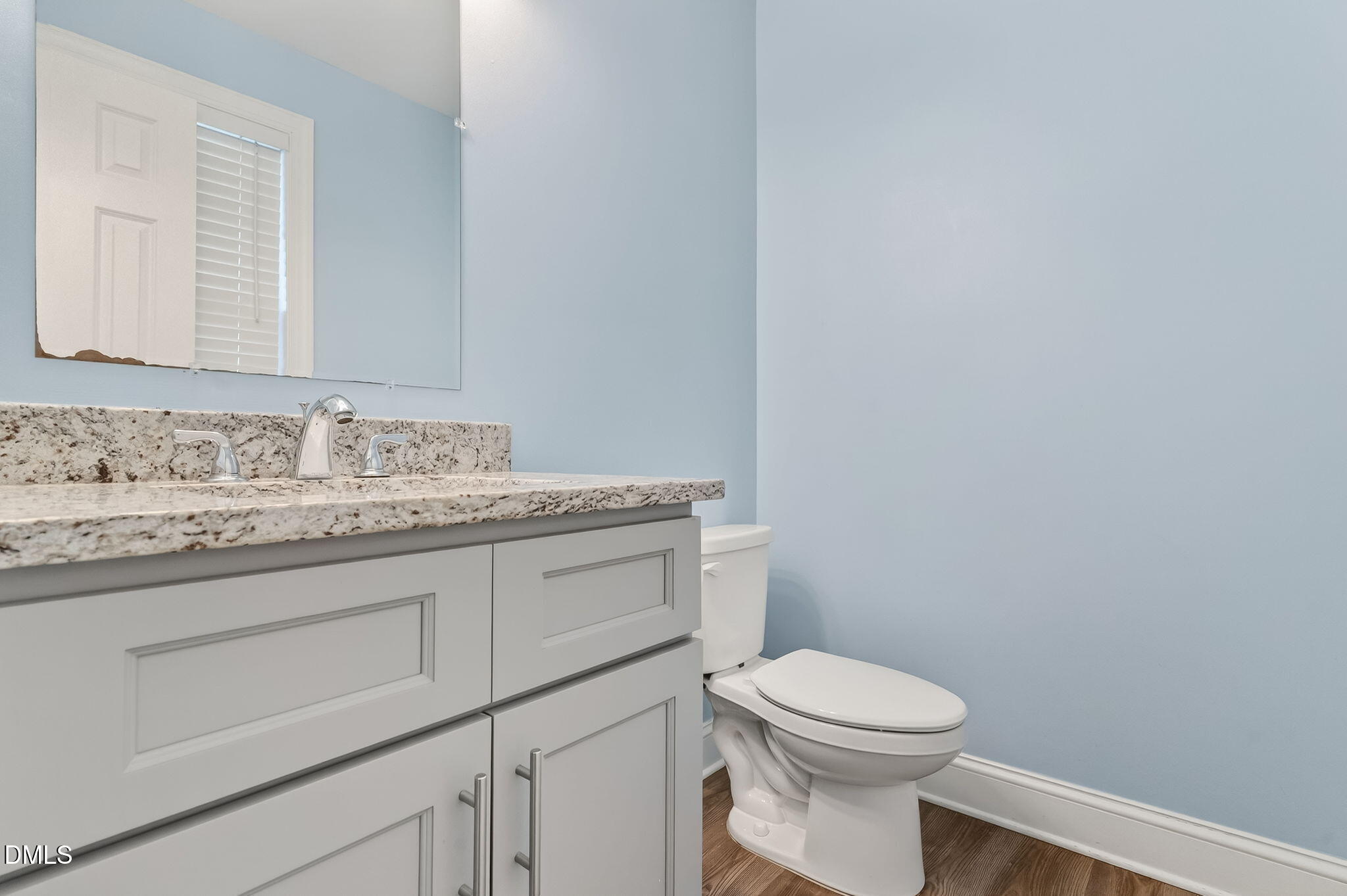 27 Duchess Court Angier, NC 27501 - Photo 17 of 50 a bathroom with a granite countertop toilet sink and mirror