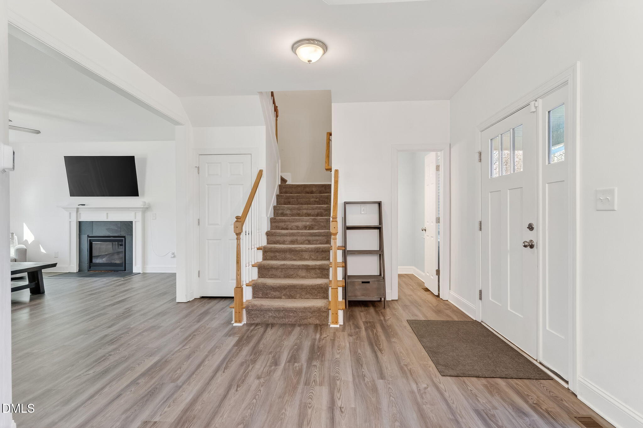 27 Duchess Court Angier, NC 27501 - Photo 18 of 50 a view of entryway with wooden floor and a fireplace