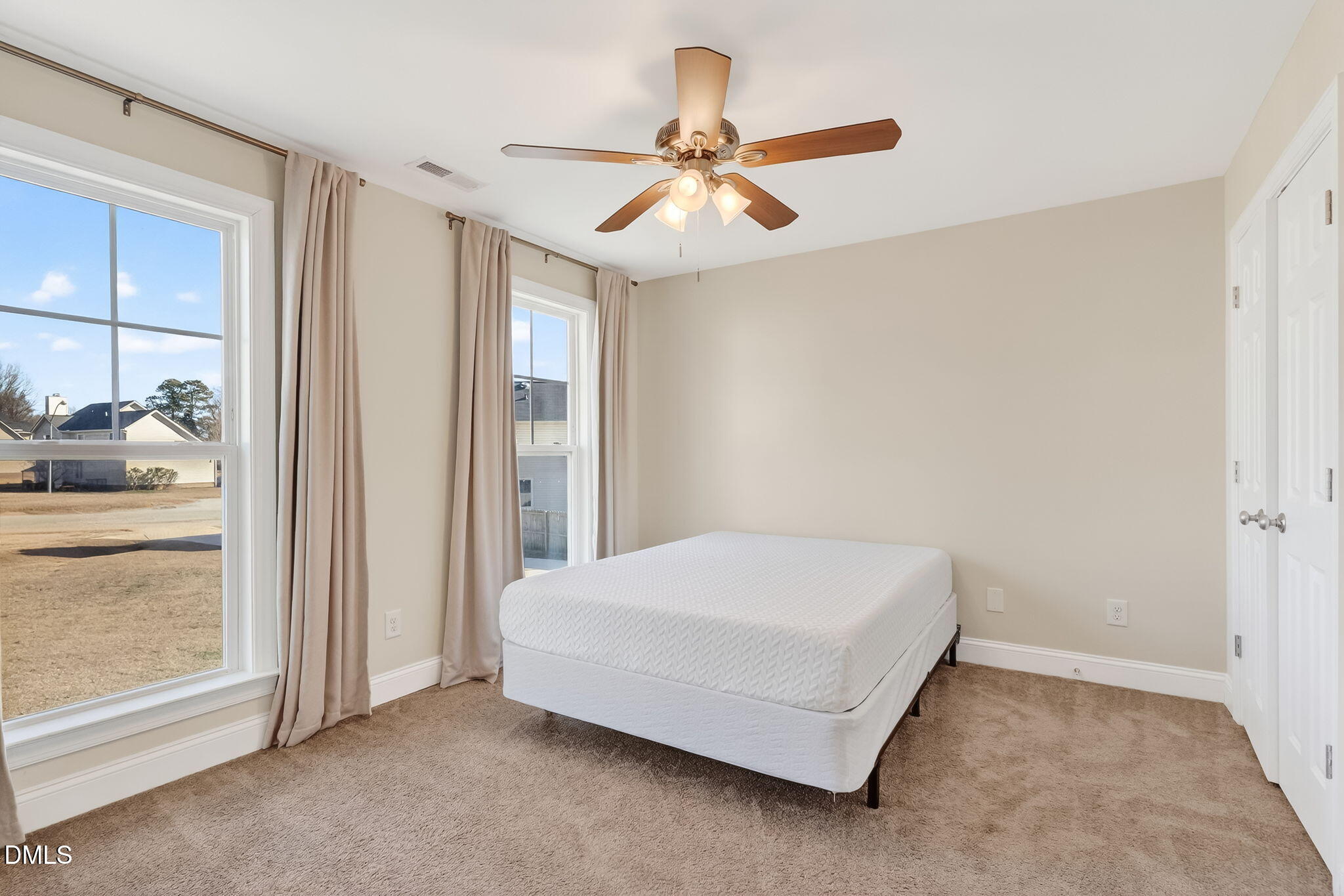 27 Duchess Court Angier, NC 27501 - Photo 22 of 50 a bedroom with a bed and a window
