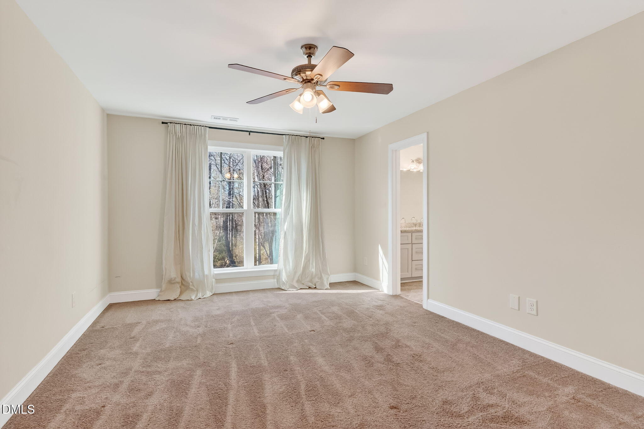 27 Duchess Court Angier, NC 27501 - Photo 28 of 50 an empty room with window and ceiling fan