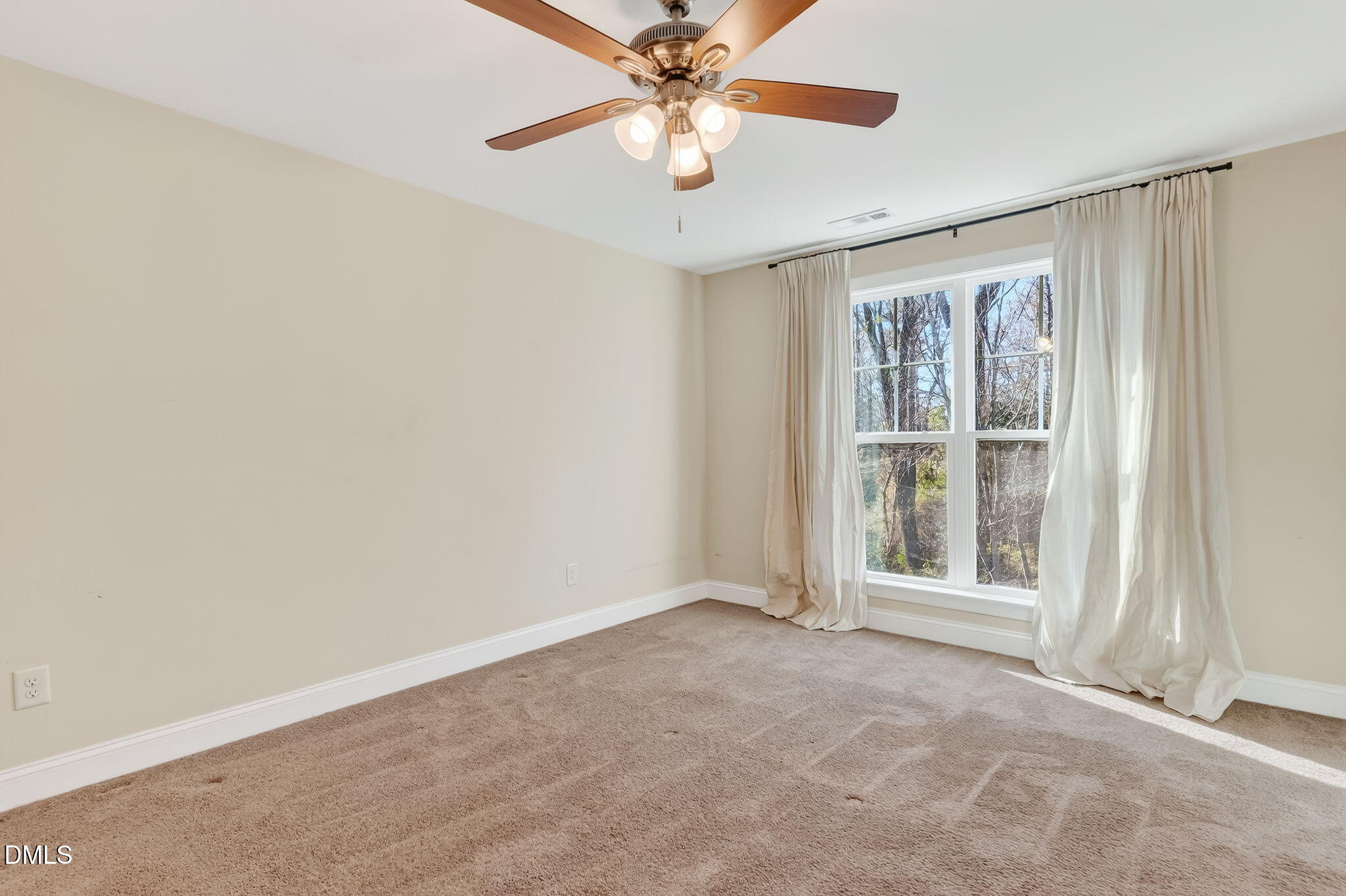27 Duchess Court Angier, NC 27501 - Photo 29 of 50 an empty room with windows and fan