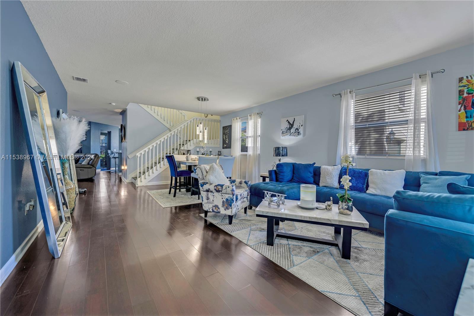 24084 Southwest 113th Path Homestead, FL 33032 - Photo 1 of 37 a living room with furniture and a wooden floor