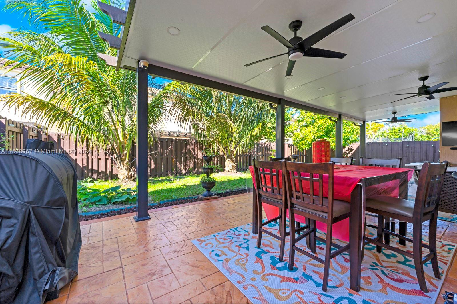 24084 Southwest 113th Path Homestead, FL 33032 - Photo 31 of 37 a view of a dining room with furniture window and outside view