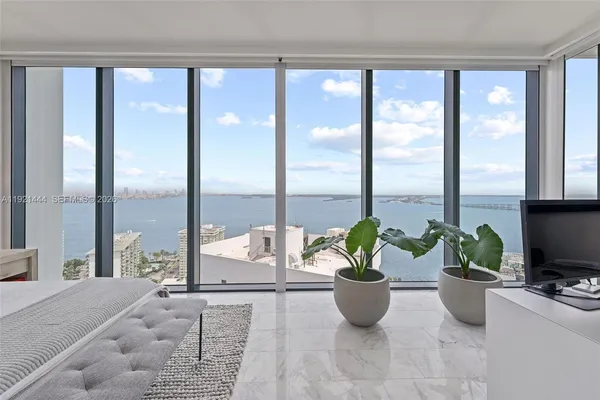 a room with furniture and a large window