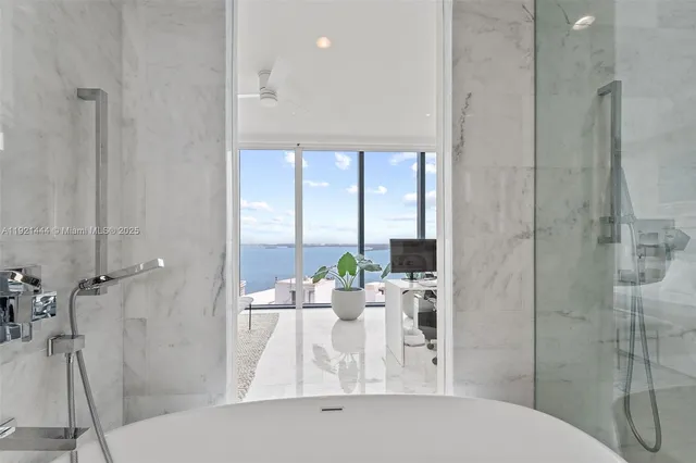 a living room with furniture and a book shelf