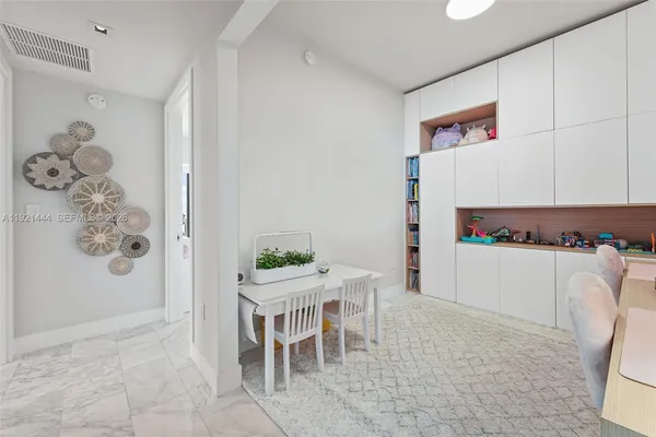 a utility room with sink dryer and washer