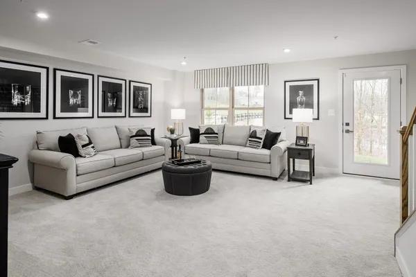 a living room with furniture and a large window