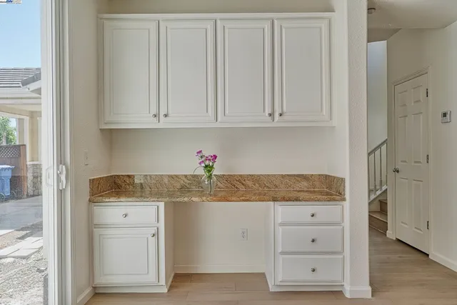 a kitchen with granite countertop white cabinets and granite counter tops