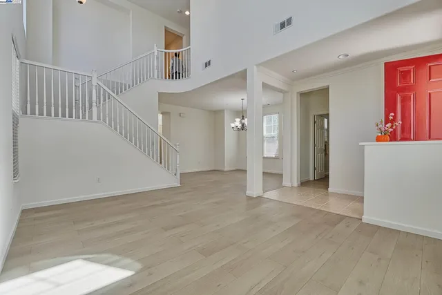a view of an entryway with wooden floor