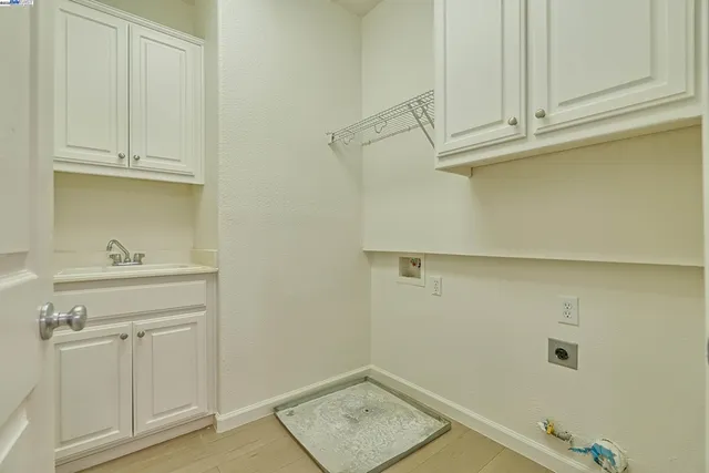 a bathroom with a sink and cabinets