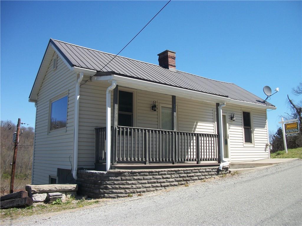 101 Carmichaels Street Rices Landing, PA 15357 - Photo 1 of 28 a front view of a house with a garage